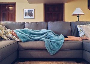 sick person with decreased immune system on couch